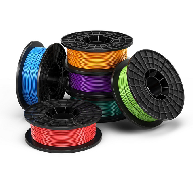 A 3D printed robotic gripper holding a food item on a conveyor belt.