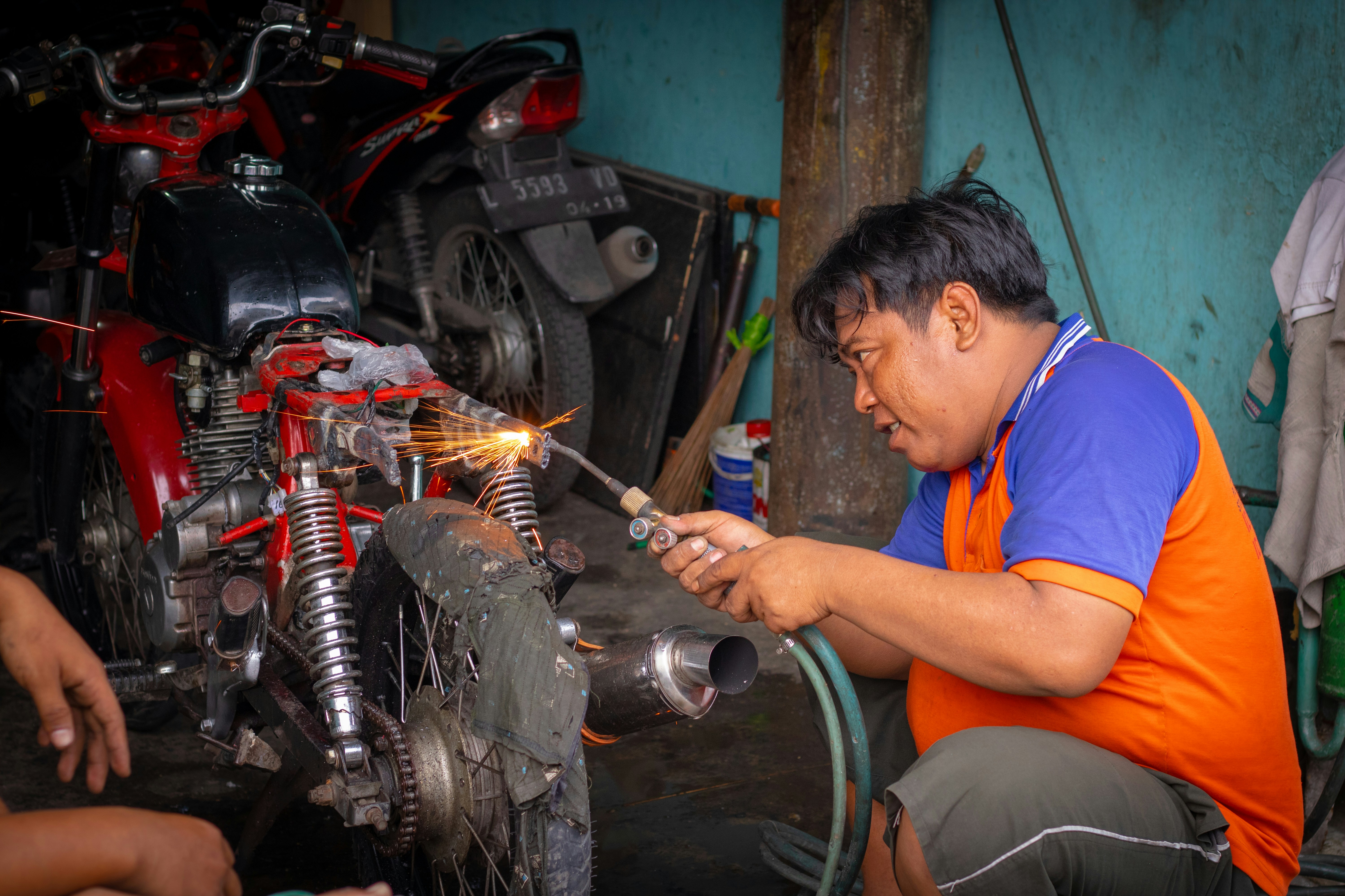 Installing Durable Auto Parts for Longevity A mechanic installing a high-quality engine component