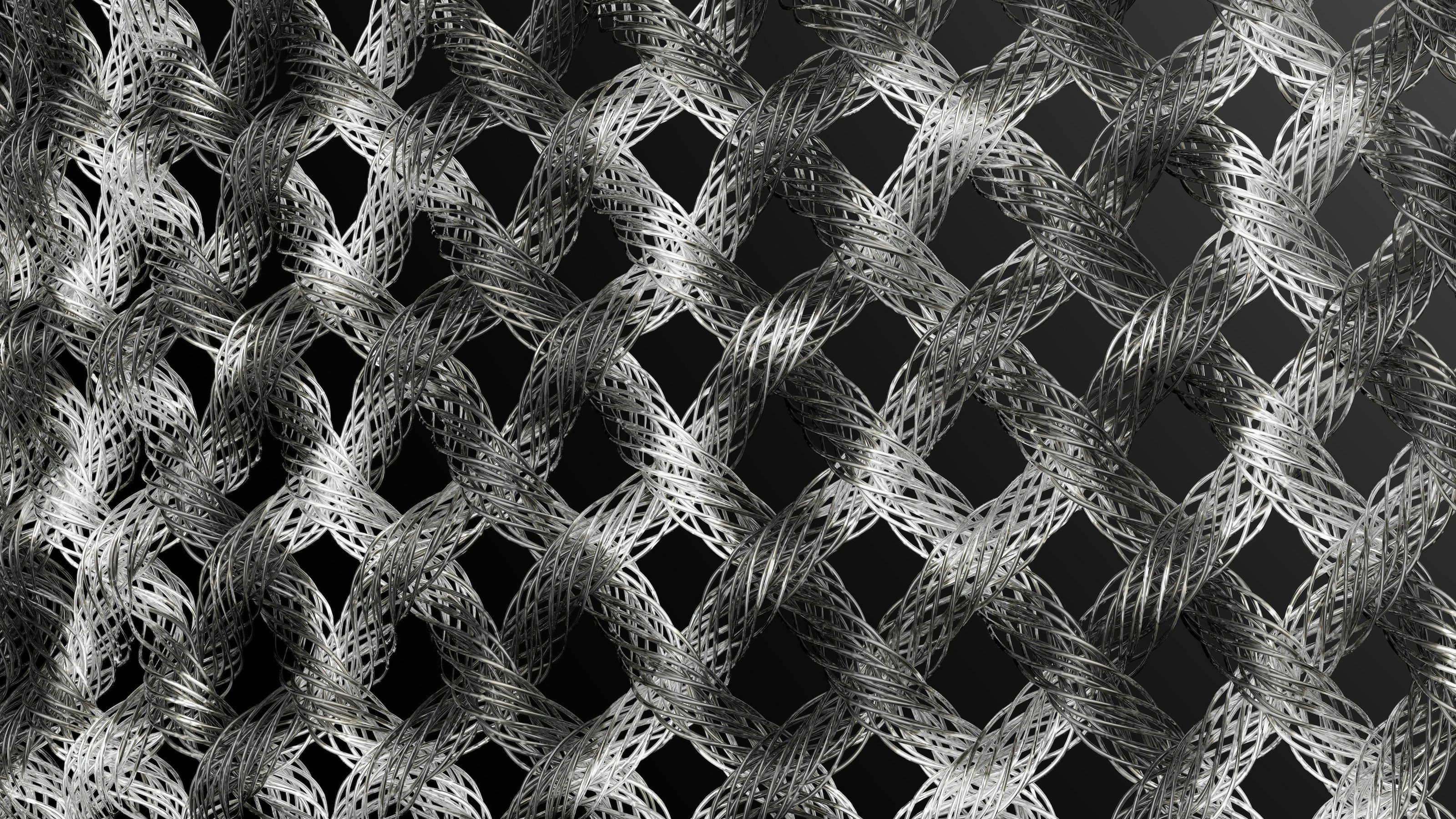 Image of a 3D printed part made from carbon fiber composite material showing the fibrous texture