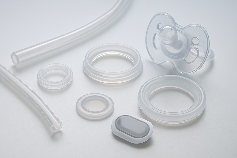 A graphic comparing the mechanical properties of LSR and TPE, showing stress-strain curves.