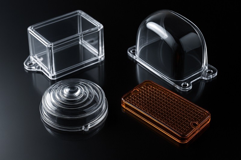 Engineers and designers collaborating over a 3D model of a custom part