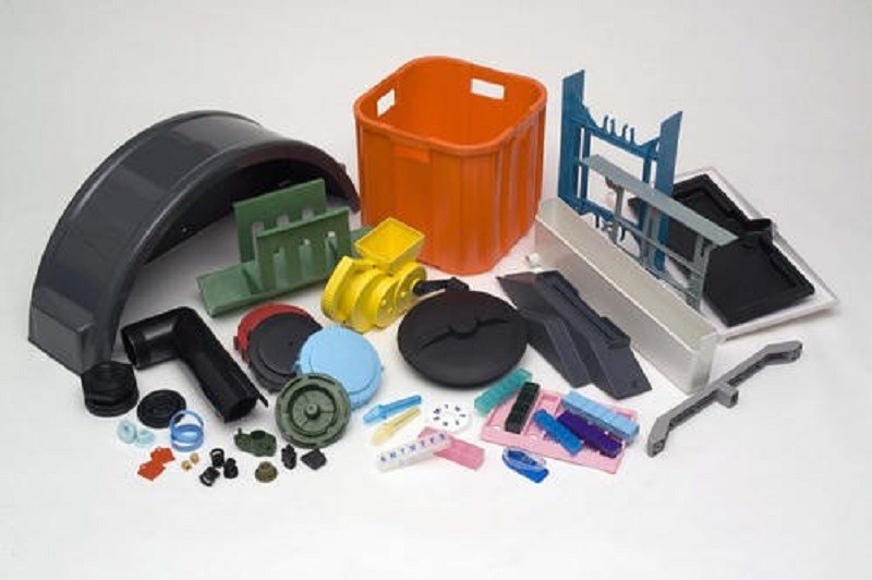 A display of custom ABS/PC parts showing a variety of textures and colors