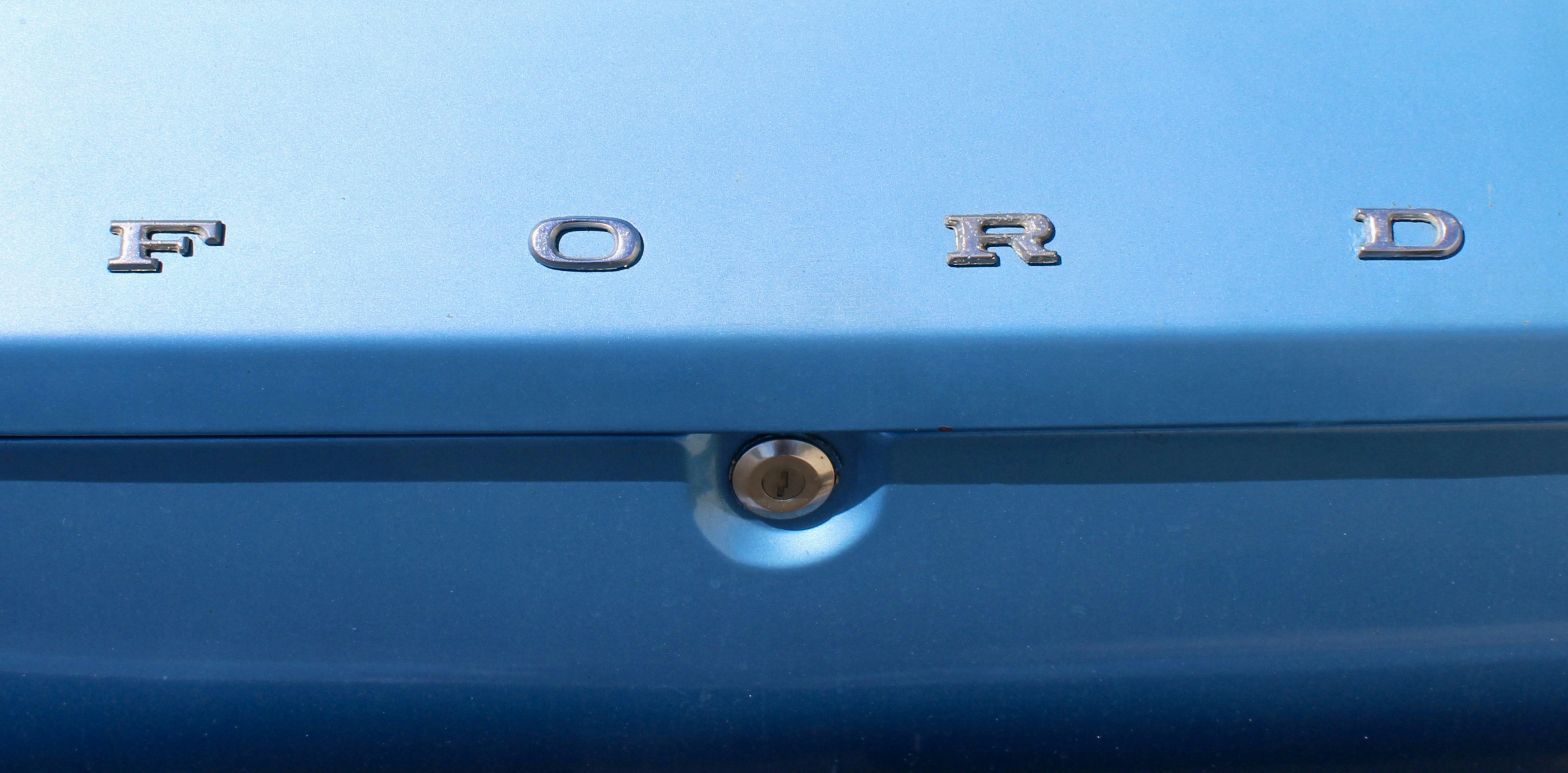 An example of insert molding with a metal screw insert in plastic.