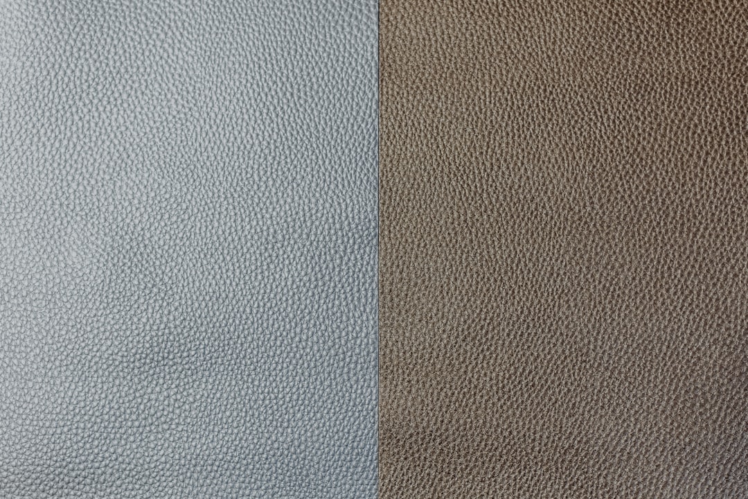 A side-by-side comparison of a grey MJF part and a white SLS part showing surface texture differences