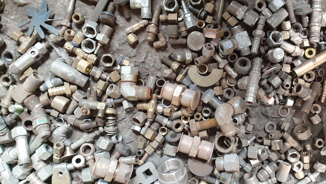 Examples of CNC machined parts in various materials like aluminum, steel, and plastic