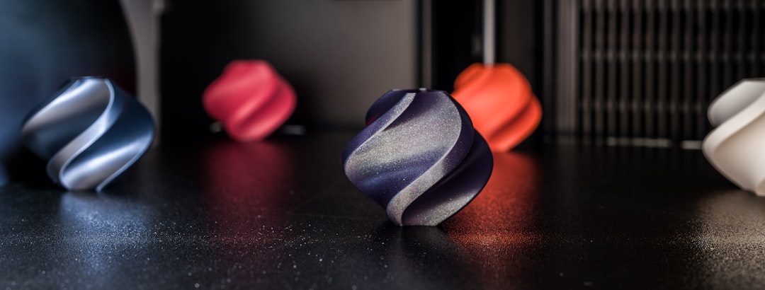 A collection of various MJF 3D printed parts in different materials and colors
