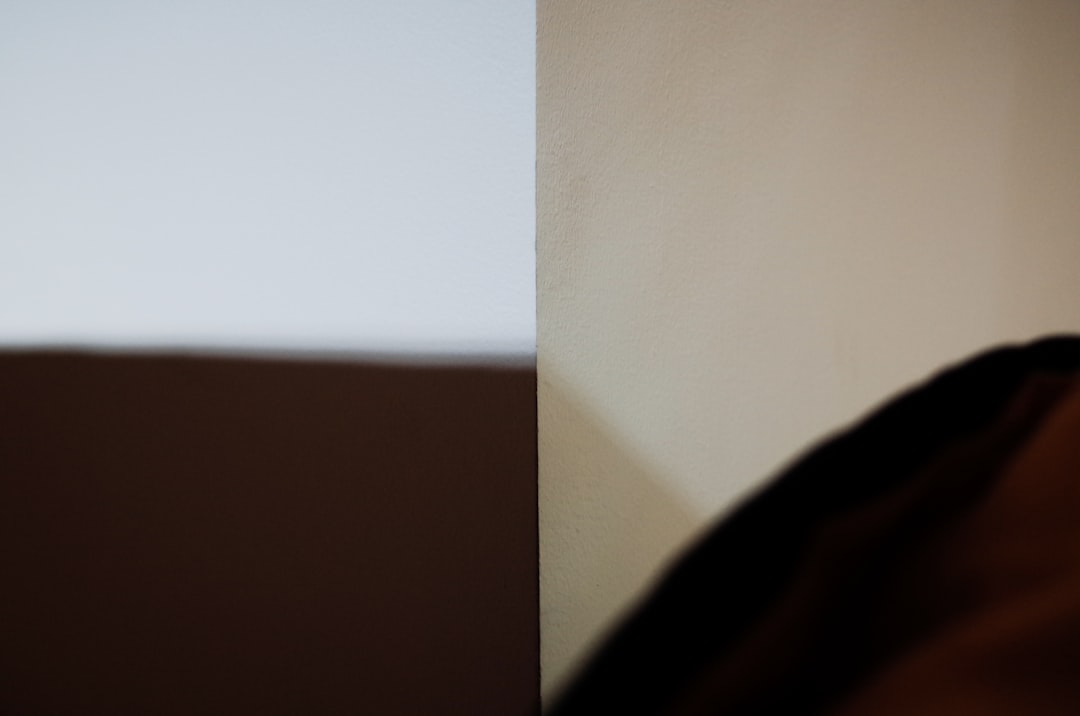 A side-by-side comparison of a raw grey MJF part and a dyed black, vapor-smoothed part