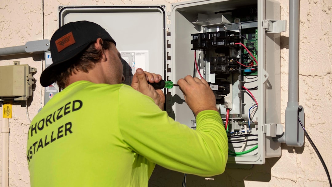 Technician using a signal level meter to test a CATV line