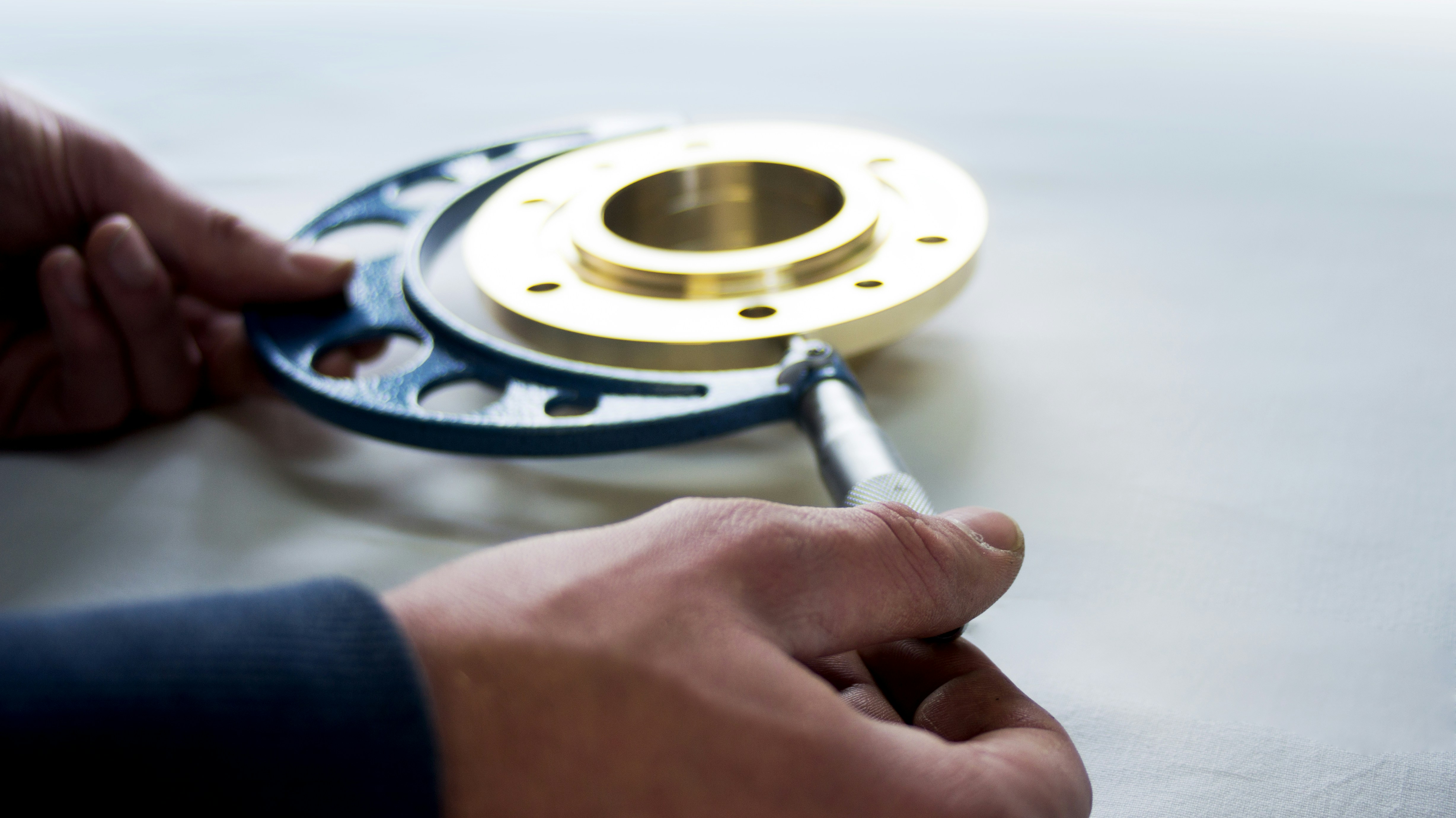 CNC Quality Assurance with a CMM Image of a Coordinate Measuring Machine (CMM) inspecting a complex metal part