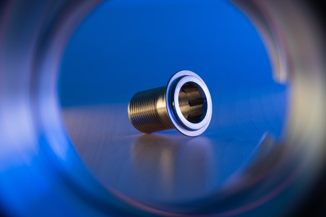Image showing a brass connector next to an aluminum one