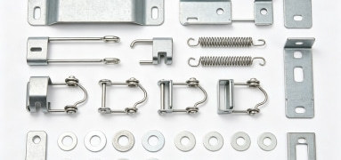 Custom stamped industrial components and machinery parts