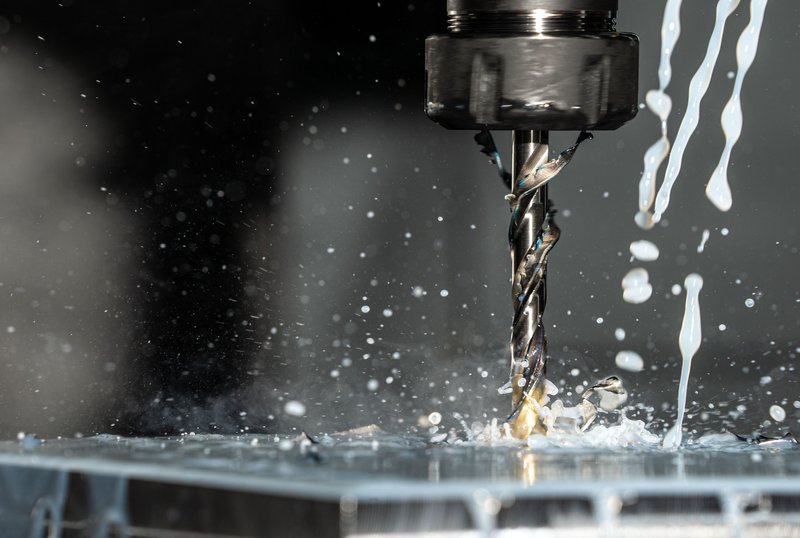 CNC milling machine cutting metal prototype part