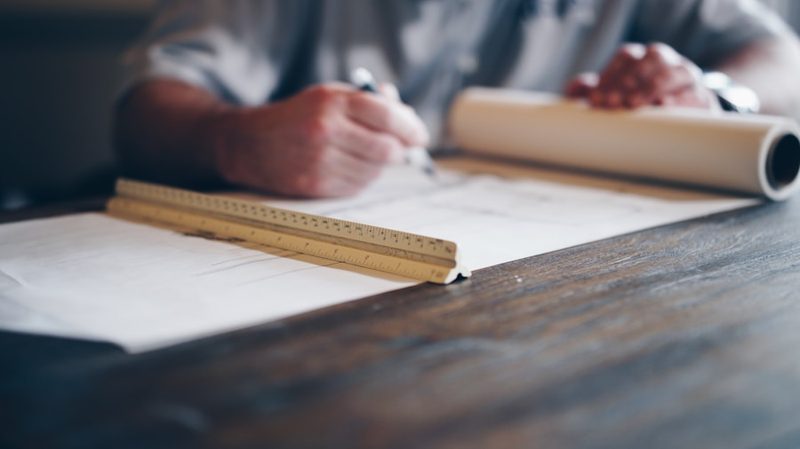 Engineering drawing with threaded hole specifications and tolerance annotations