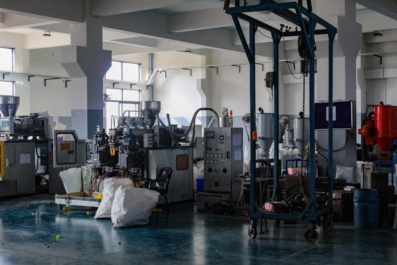 Industrial factory interior with injection molding machinery and equipment