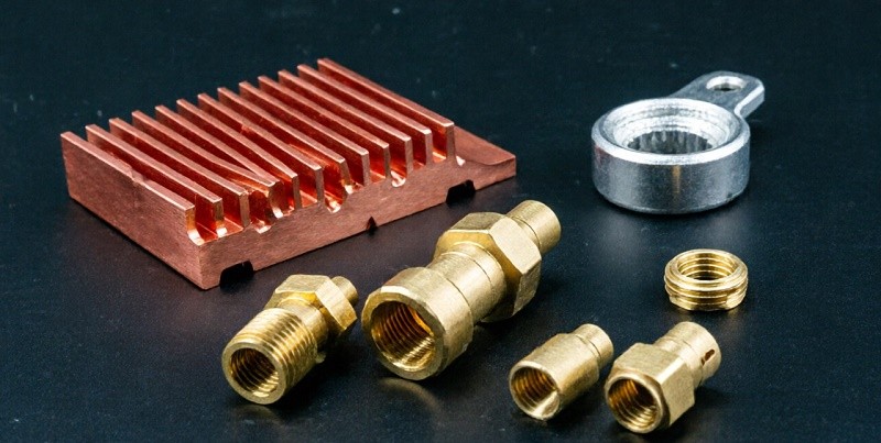 brass hardware parts such as door knobs and fittings machined from brass alloys