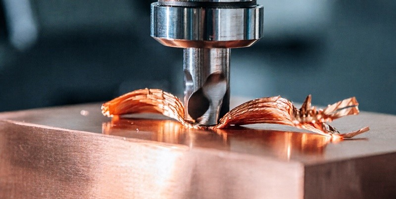 machined brass and copper alloy parts pile with gold colored metal components