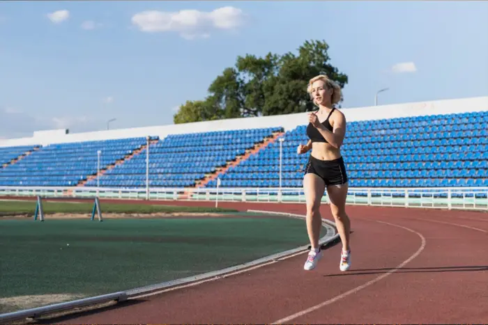 Runner using an outdoor track surfaced with colored EPDM granules
