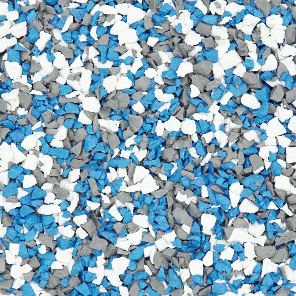 A vibrant, high-energy dopamine-colored playground surface featuring custom EPDM color granules