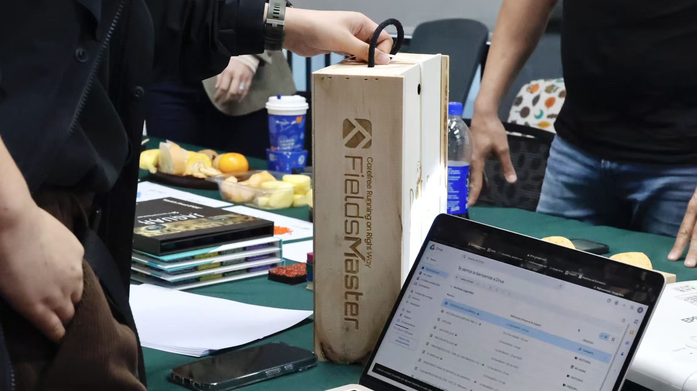 Spanish playground clients visiting FieldsMaster exchanging customized gift wine