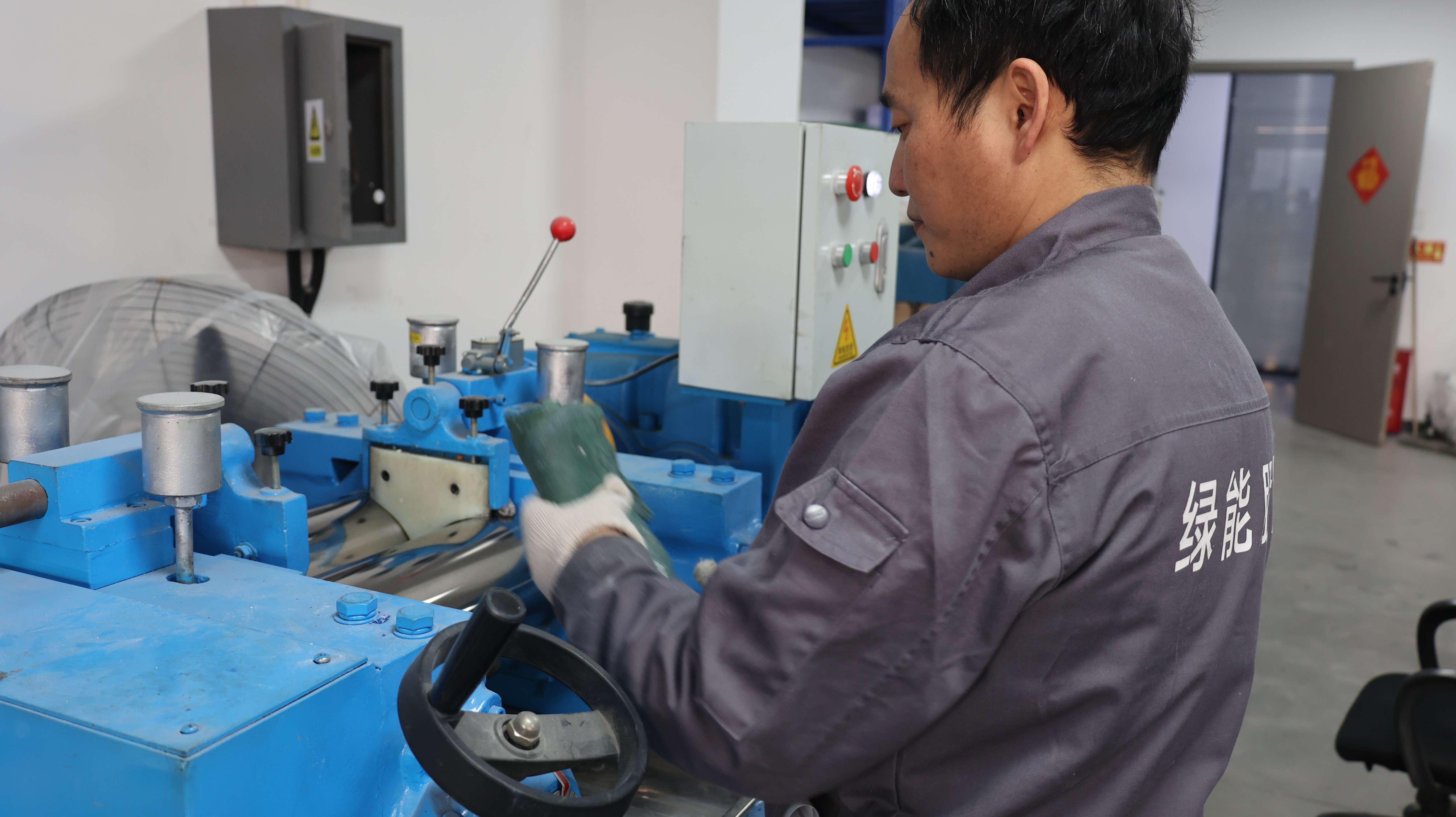 A wide shot of the FieldsMaster laboratory showing the tensile testing machine in action