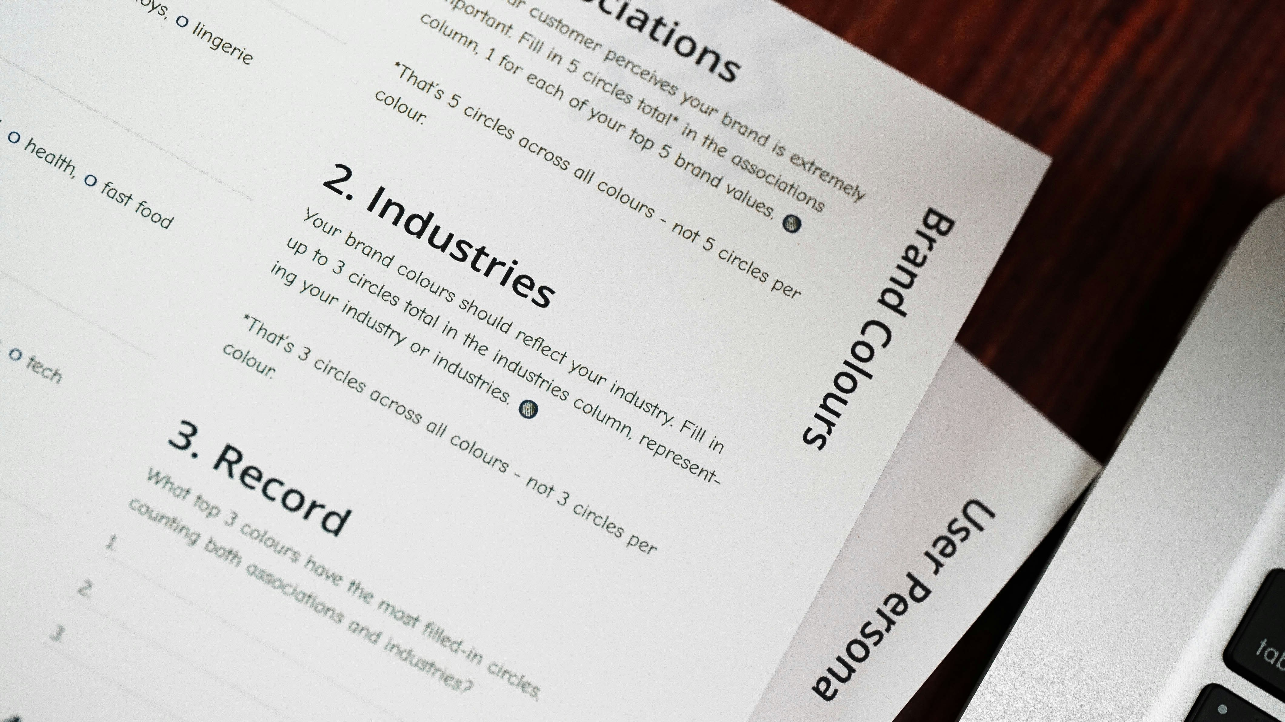 A magnifying glass over a document with pricing and competitor names