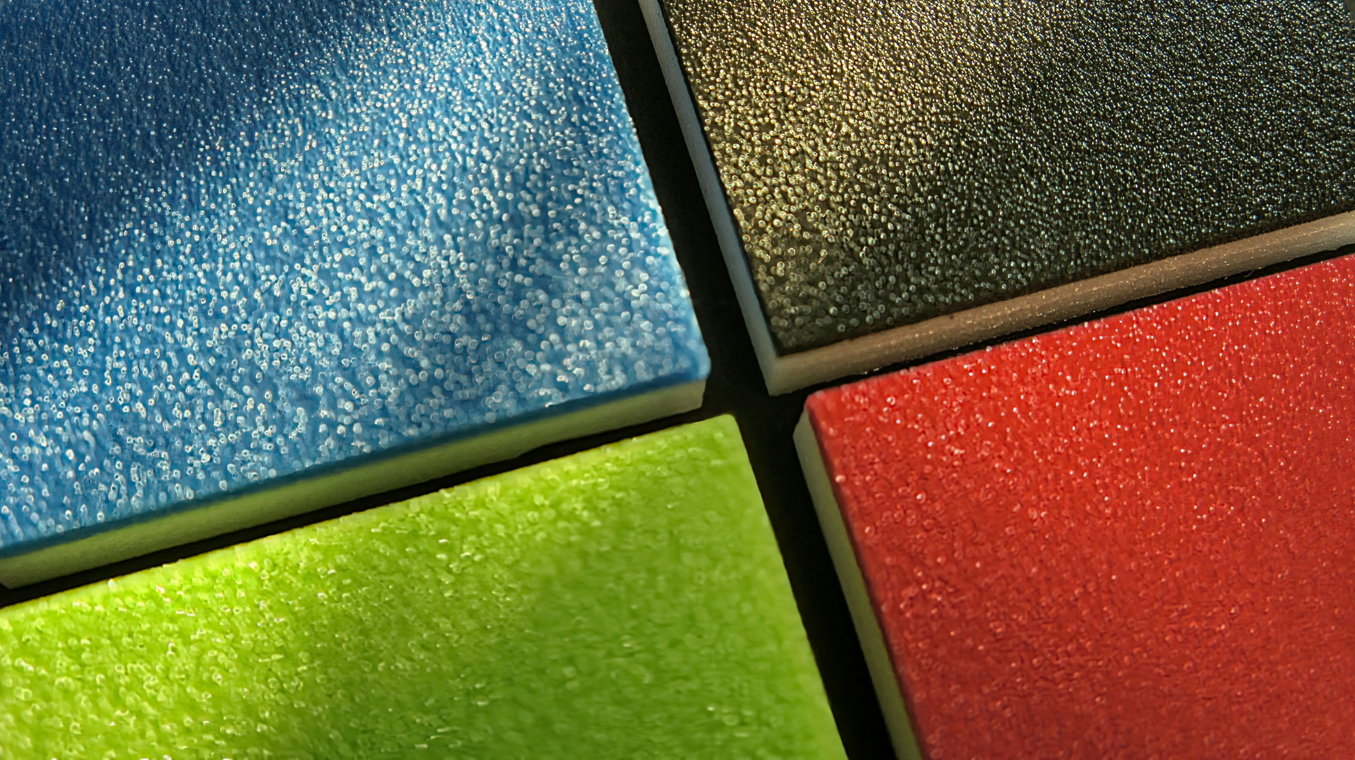 A collage showing the vibrant, non-fading colors of an EPDM surface over several years