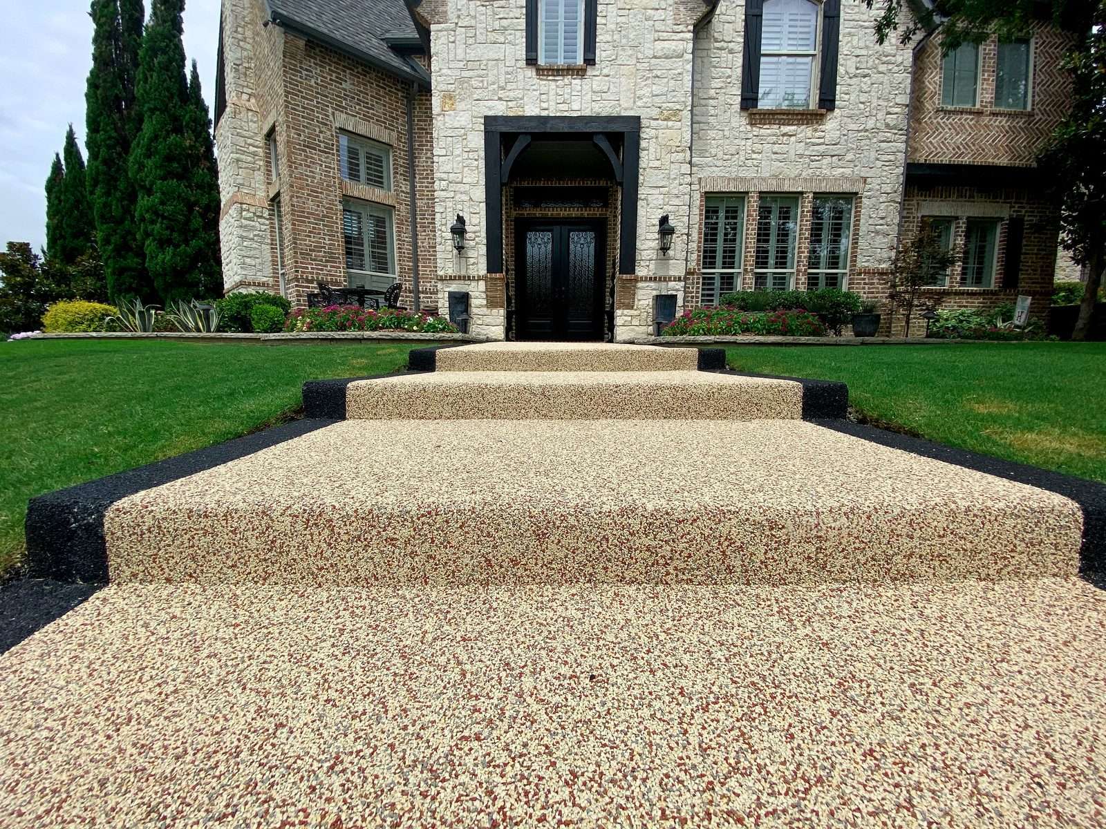 Rubaroc surfacing integrated with a private residential patio and garden