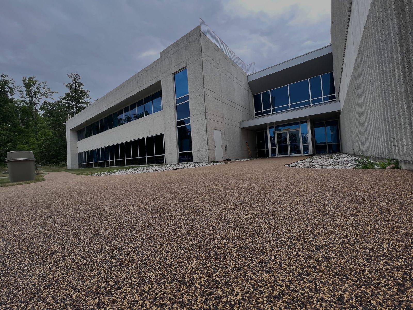 Dark mixed-color Rubaroc driveway in front of a residence