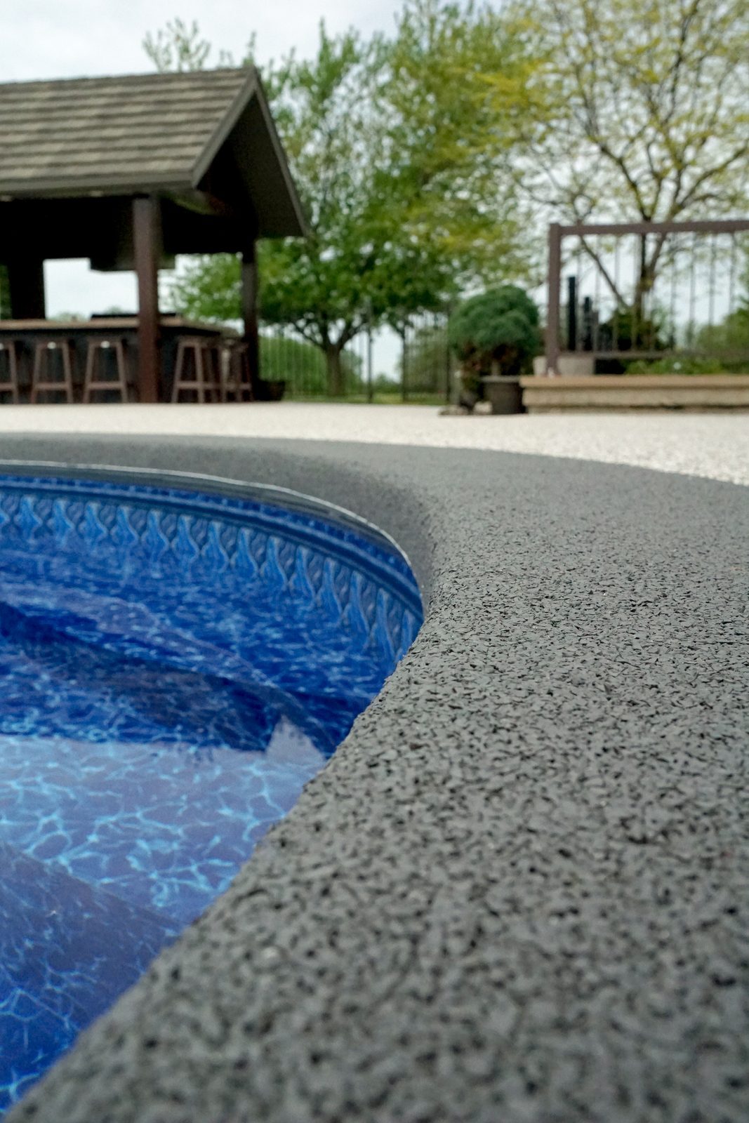 Rubaroc surfacing around an outdoor swimming pool