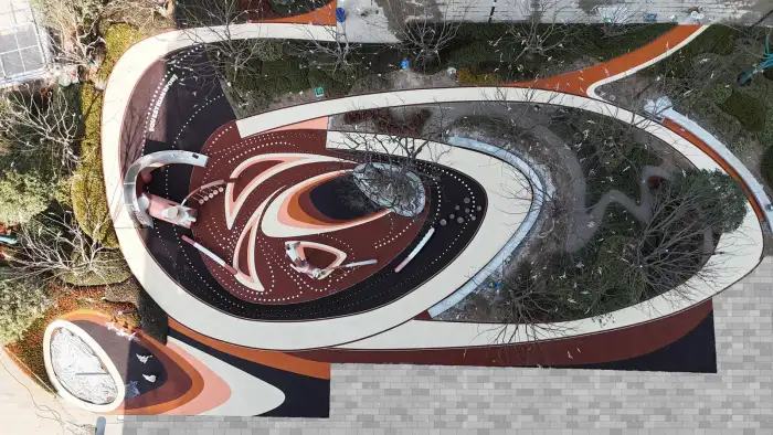 Aerial view of colored EPDM paths integrated into a landscaped community area