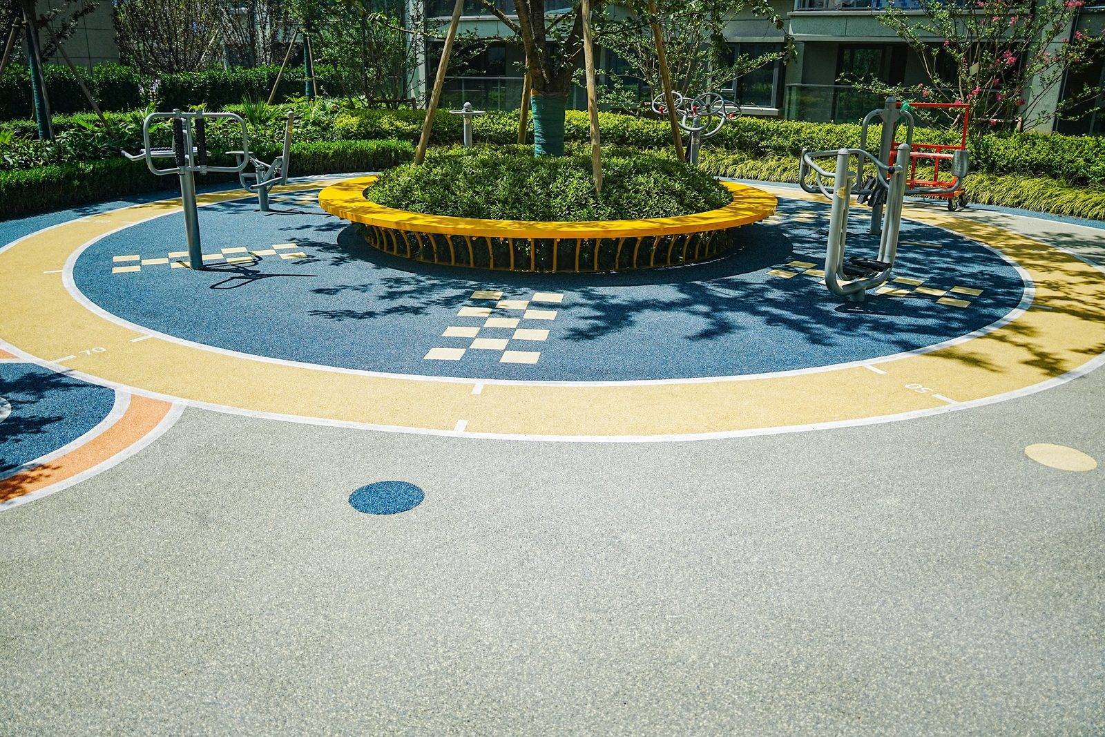 Blue yellow and light gray recreational path with outdoor fitness equipment at Ningbo Baoli Langyue Xuzhang