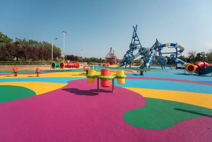Colorful EPDM granule playground surfacing with multi-color zones and graphic patterns