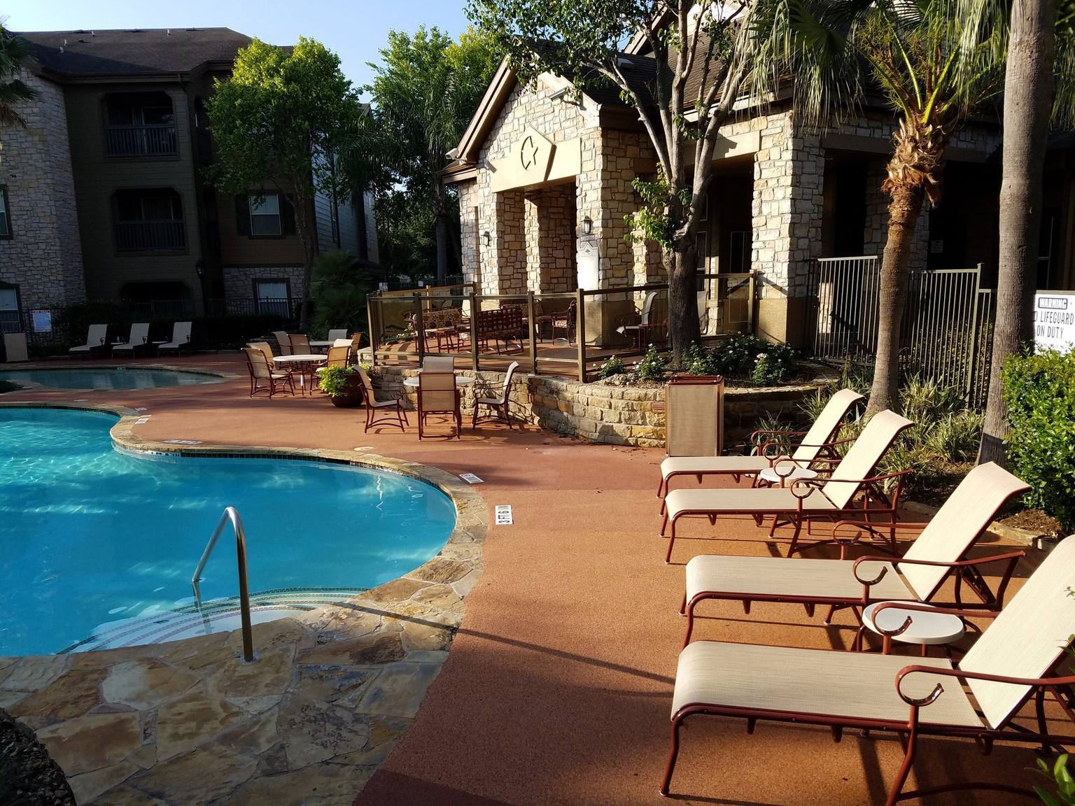 EPDM pool surround surfacing beside a swimming pool