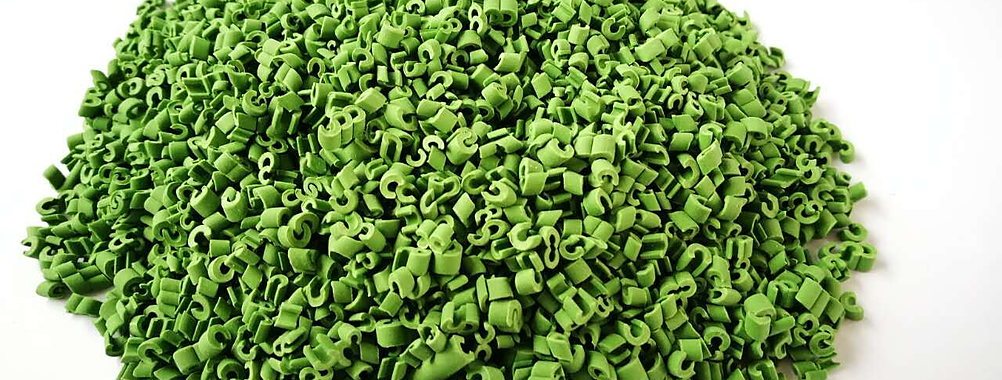 Green ETPU granules used in impact-attenuating surfacing base layers