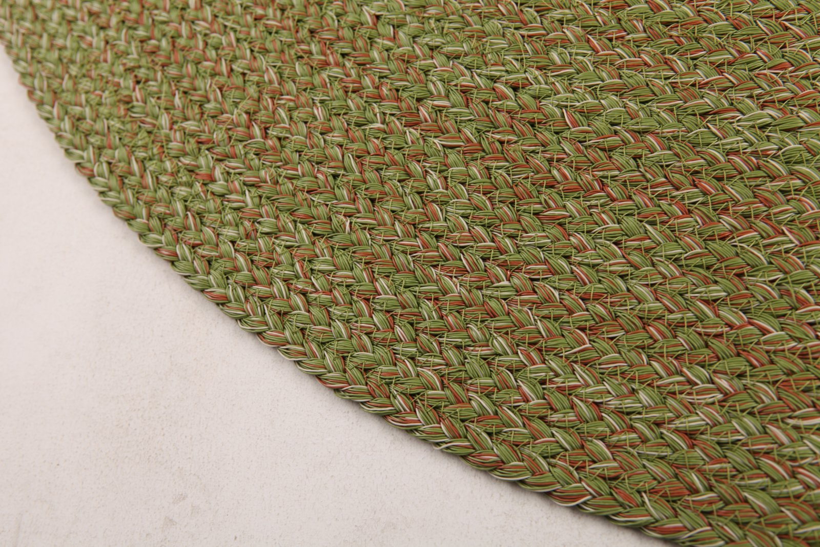 Spiral braided round rug edge close-up