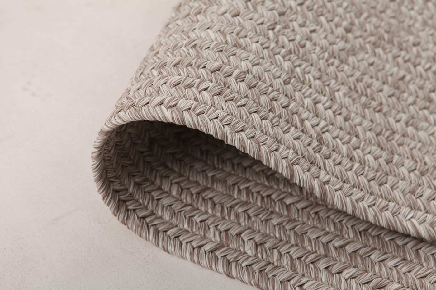 Curled edge showing flexible rope-woven construction