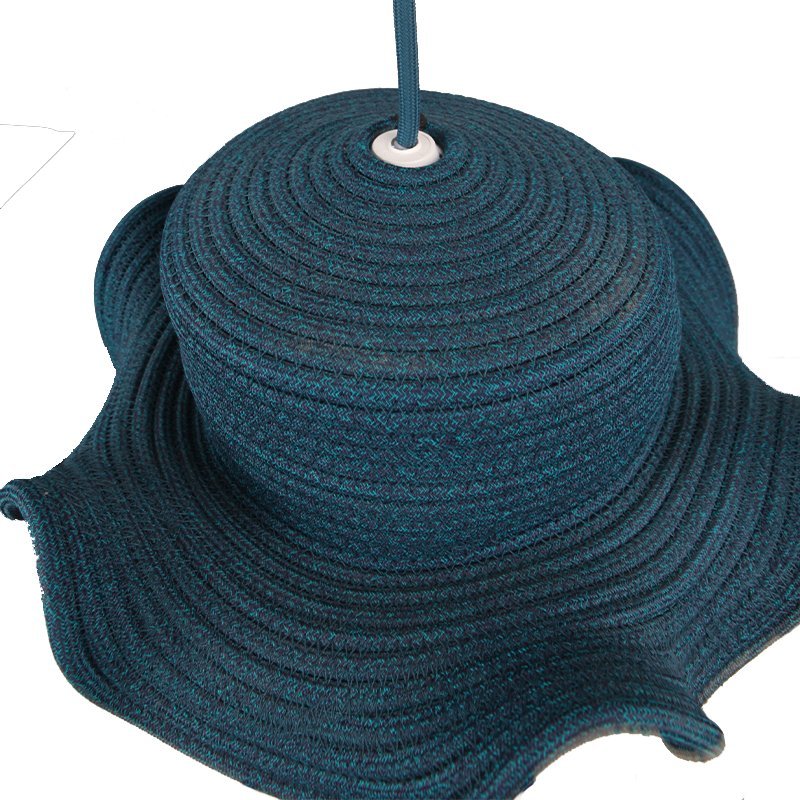 Top view of the densely coiled deep blue rope lampshade