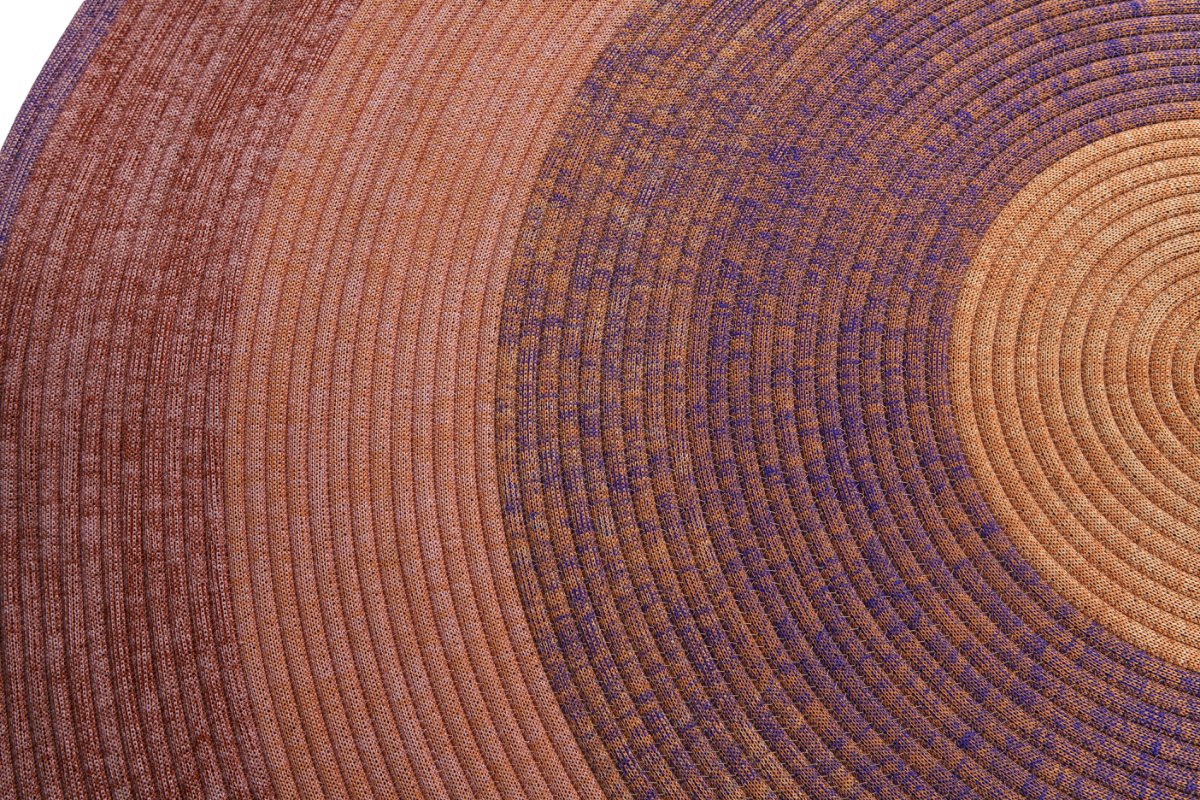 Concentric coil bands photographed close to show rope texture and three solution-dyed shades
