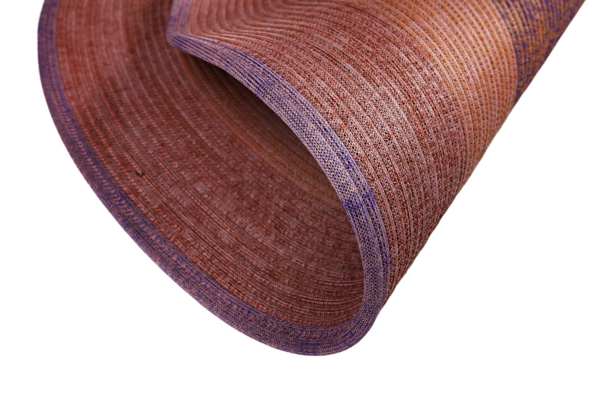Round rope carpet rolled partway to show flexibility of the coil and thickness of the weave