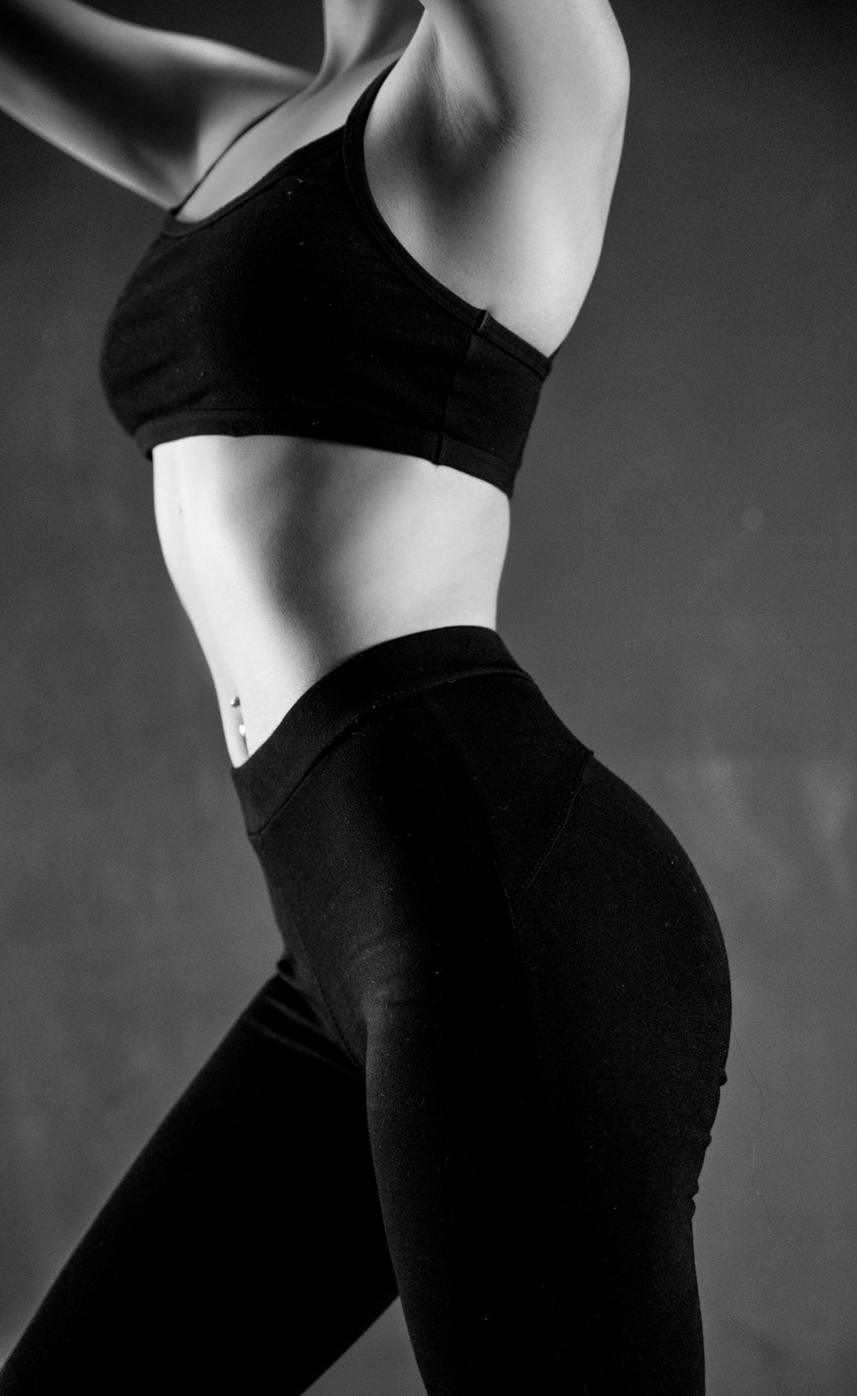 Logo-free black sports bra and leggings showing garment fit and construction
