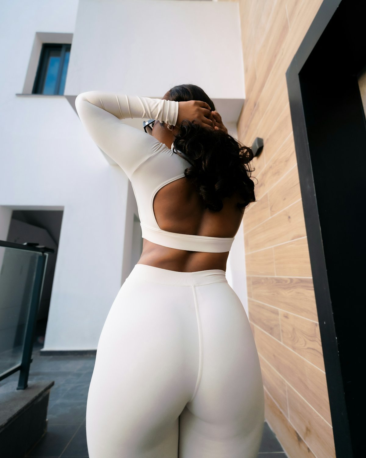 Woman wearing white athletic apparel outdoors