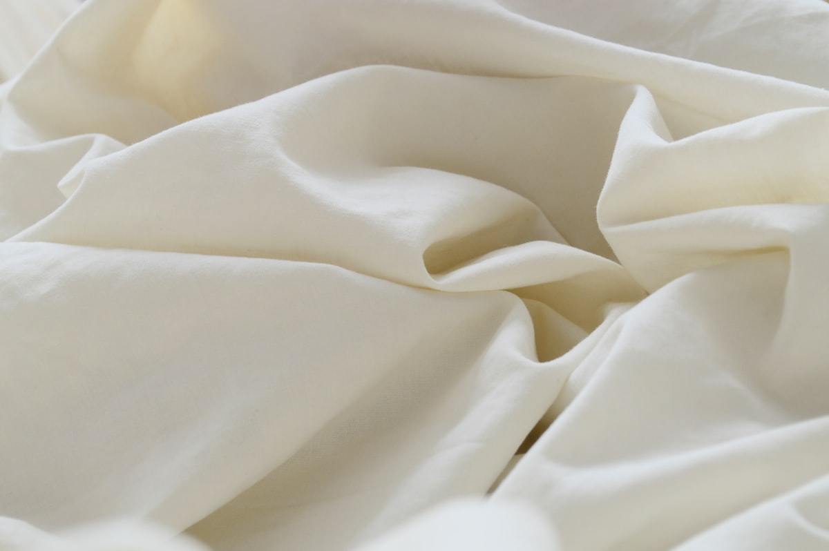 Close-up textile surface used to illustrate fabric inspection during activewear sampling