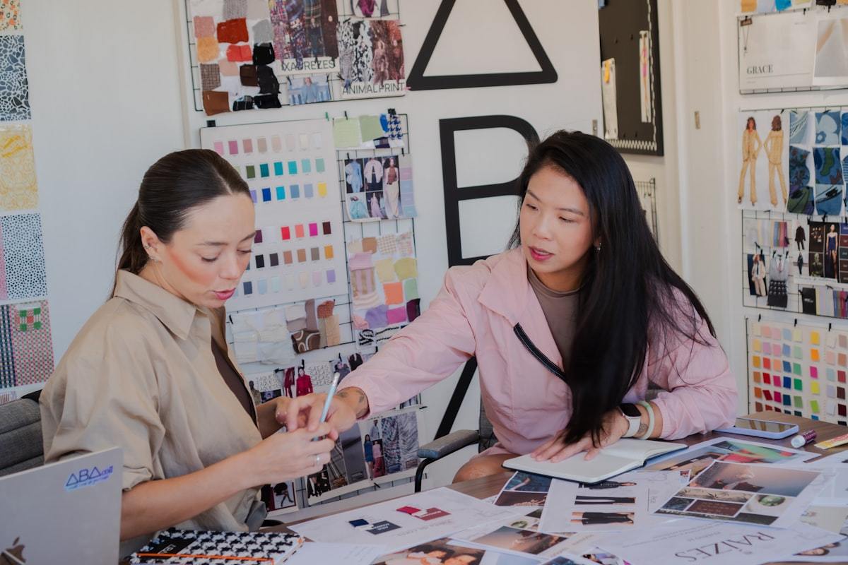 Design team comparing fabric swatches during apparel product development