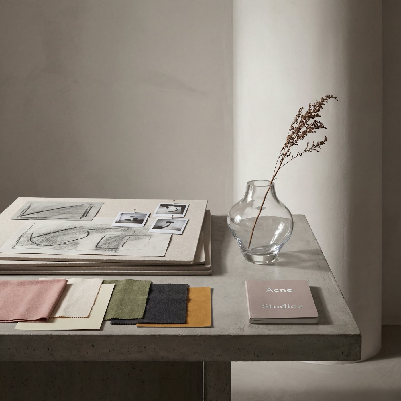 Fabric swatches, color references and apparel design sketches on a table