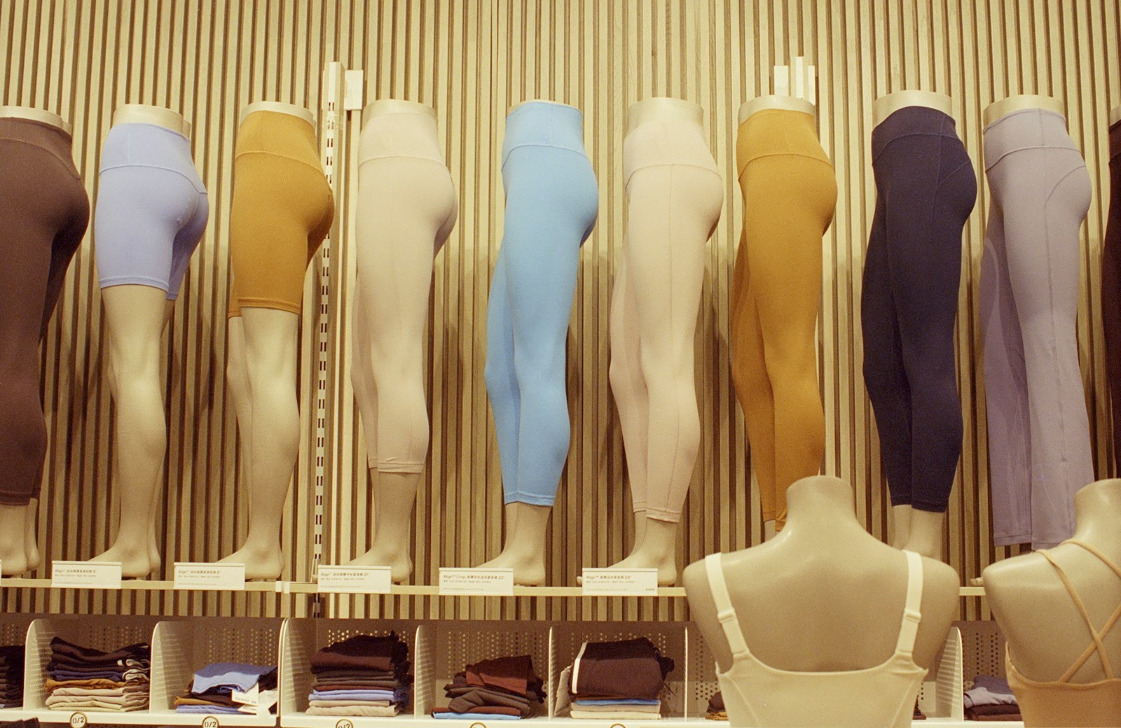 Activewear leggings in multiple colors and lengths displayed on mannequins
