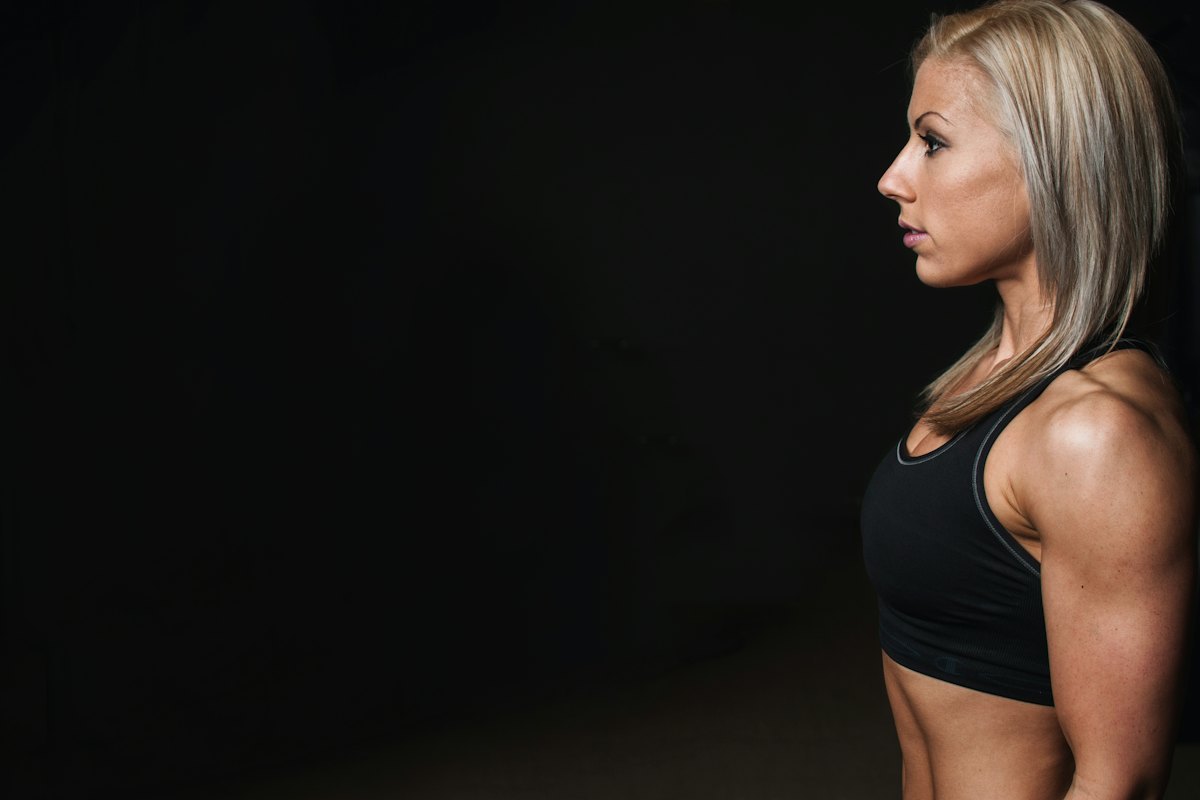 Athlete wearing a black sports bra in a gym