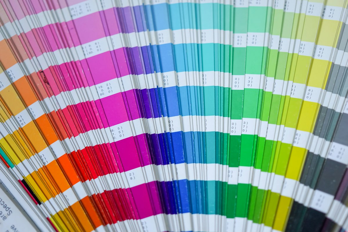 Close-up of a fan of printed color swatch cards