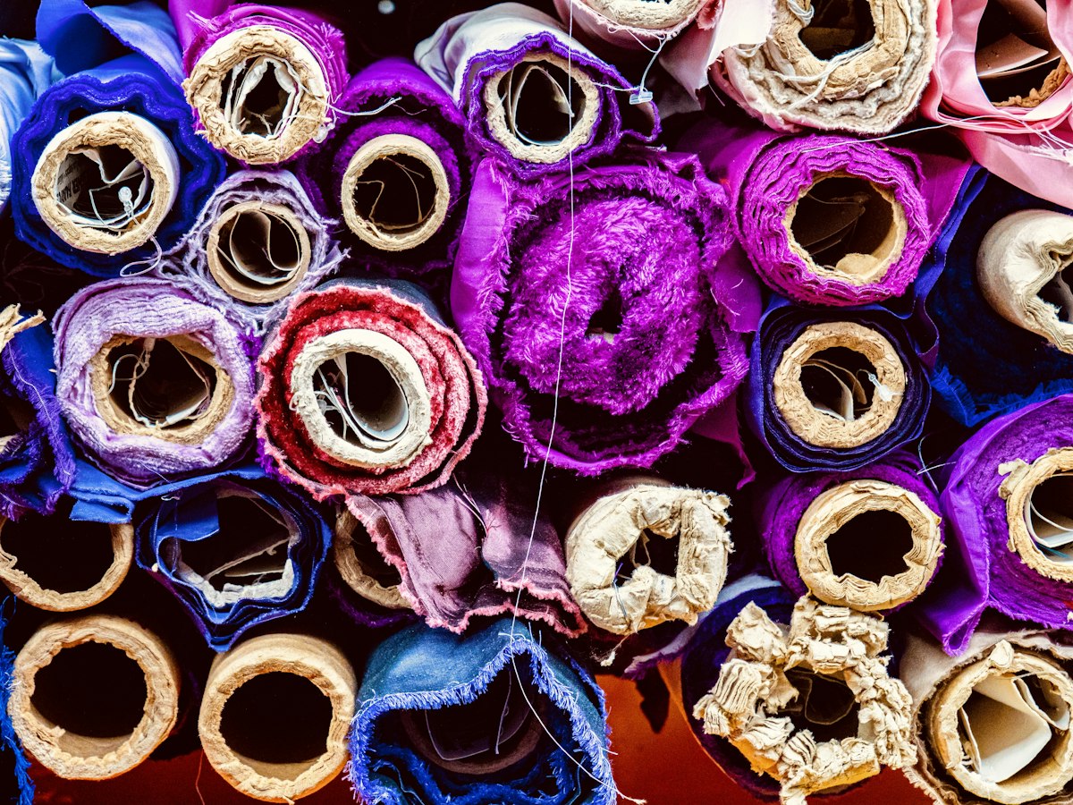 Colorful fabric rolls stacked together