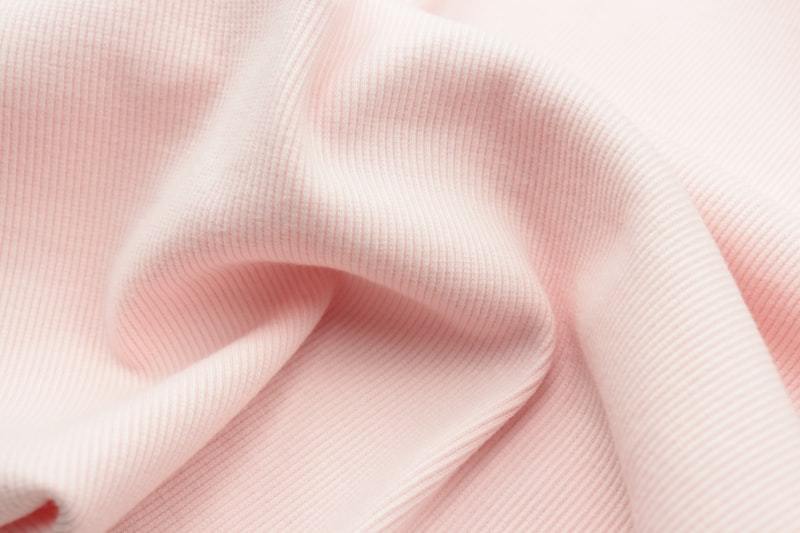 Folded cotton fabric materials in various colors for apparel production