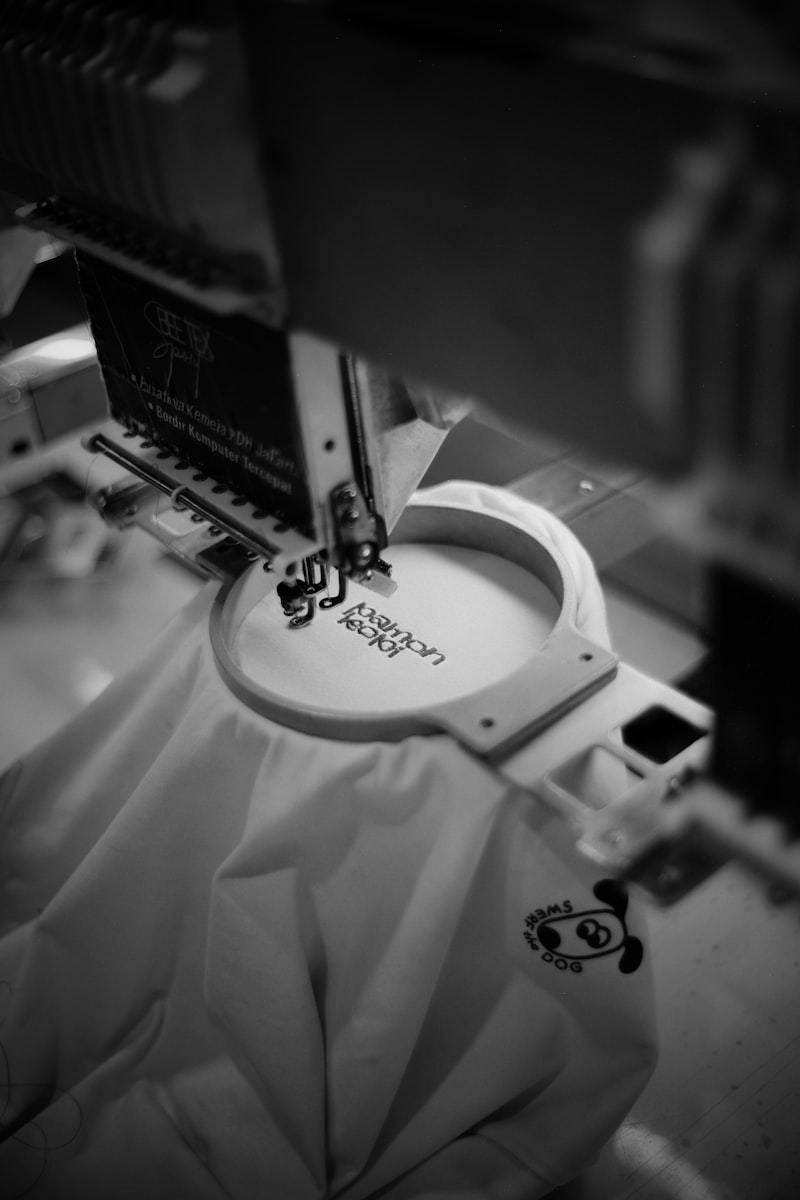 Industrial embroidery machine stitching a design onto fabric